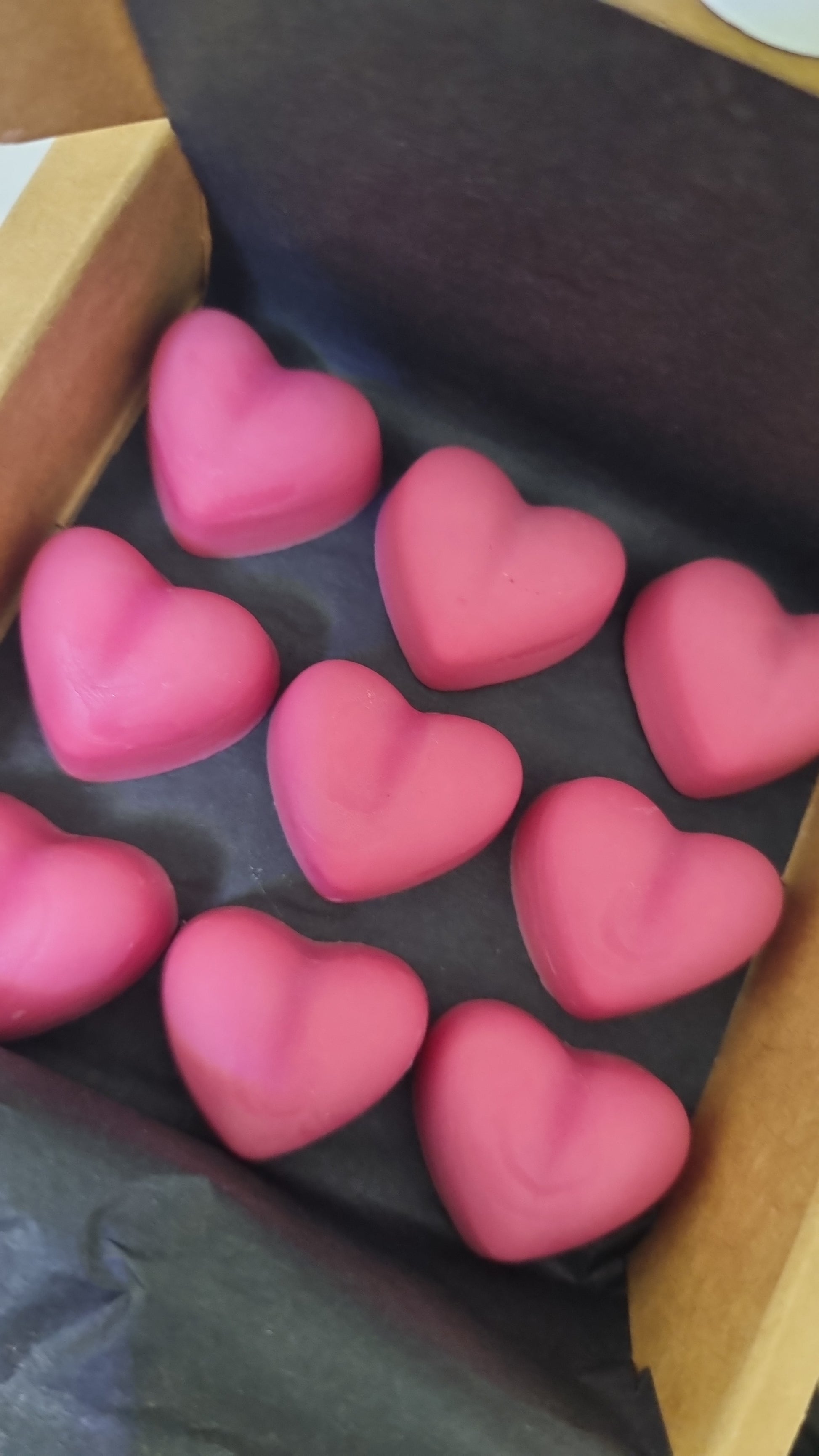 A box of pink soy, bees wax melts in Lush Linen scent